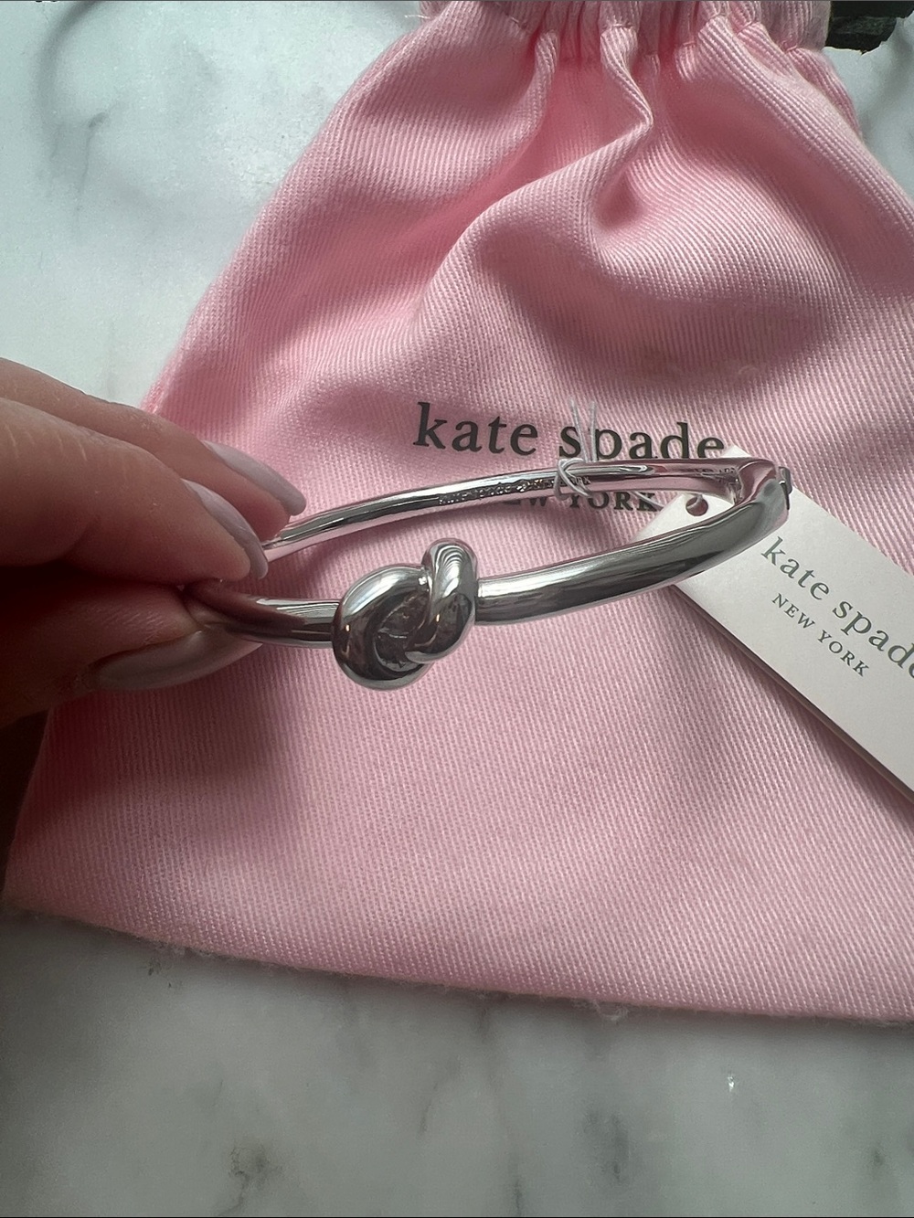 kate spade Silver Knot Bangle with Pink Drawstring Pouch - Picture 2 of 2
